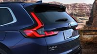 Rear of Sport Touring Hybrid Honda CR-V 2023 with AWD shown in Canyon River Blue Metallic.